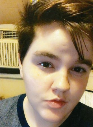 selfie of young person with short hair