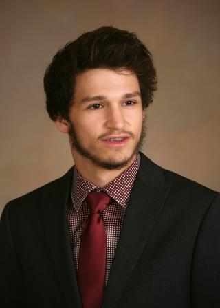 studio portrait of a young man in suit and tie