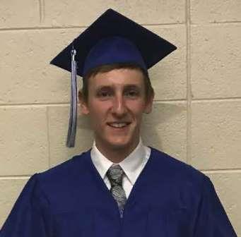 young man in dark blue cap and gown