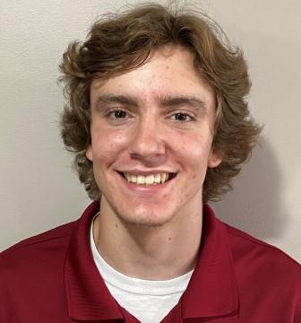smiling young man with red shirt