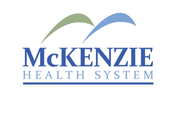 A logo for McKenzie Health System. Above the blue text name, which has 'HEALTH SYSTEM' underlined, are two curved shapes: one green, one light blue.